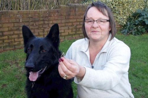 Angie Collins with Jack and the diamond ring the would-be police dog swallowed.